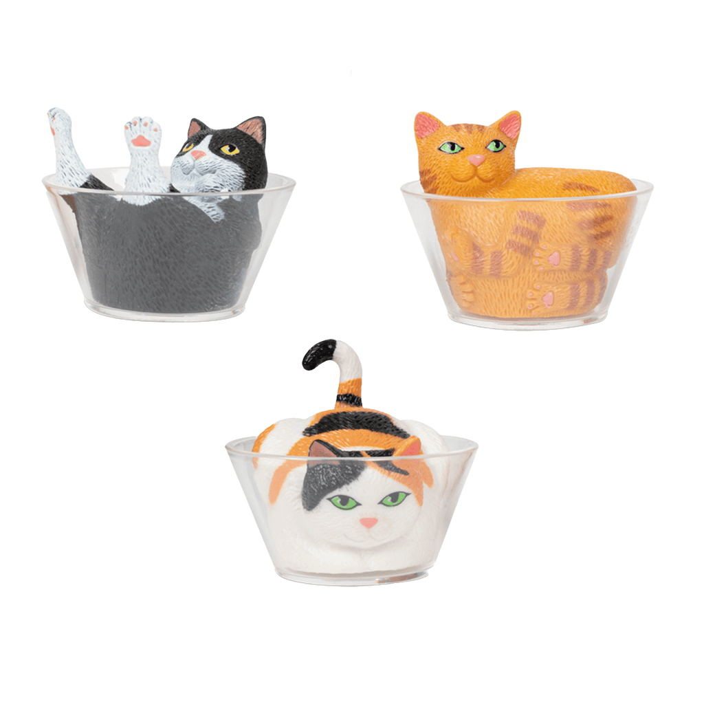 Three cat-shaped bowls with cat figures inside on a white background