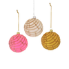 Three concha pastry styled ornaments in pink, beige, and gold on a white background