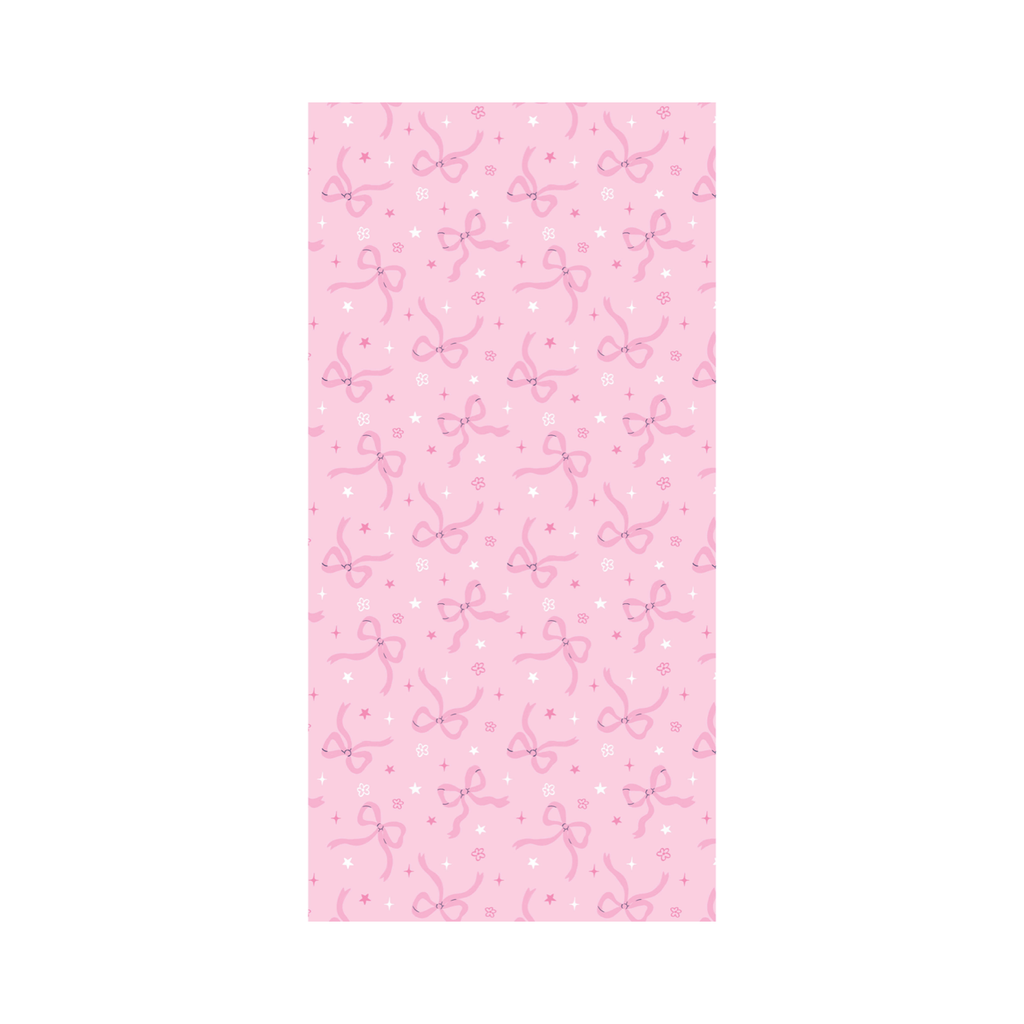 Pink tissue paper with bow and floral dot and star pattern on a white background