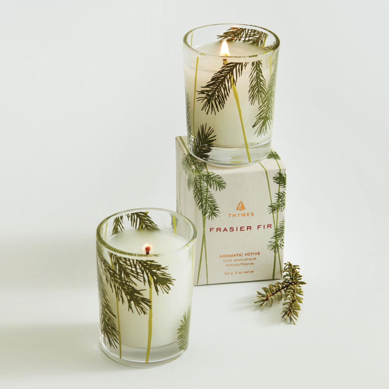 Thymes Frasier Fir Pine Needle Votive Candle from Thymes Urban General Store